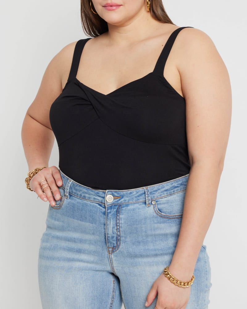 Front of a model wearing a size 14|16 Ellie Twist Detail Tank in Totally Black by ELOQUII. | dia_product_style_image_id:215082